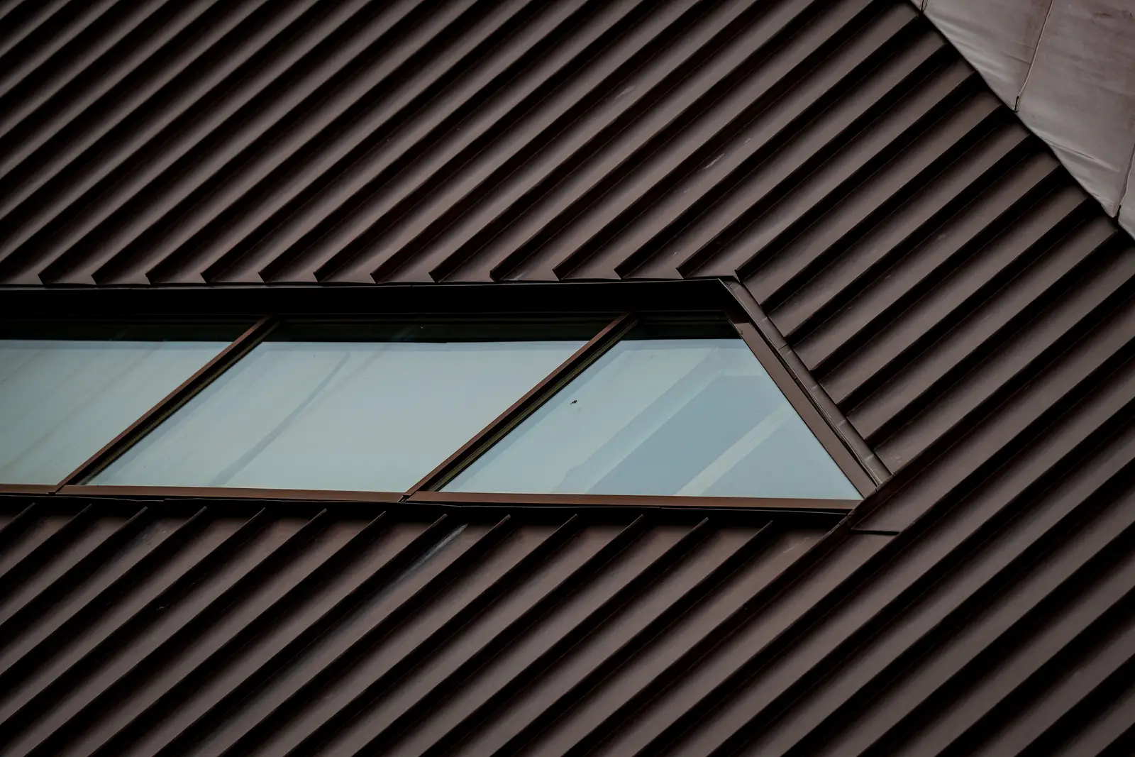 Standing seam metal roof panels and skylight detail on a Vermont home, VT Metal Roofing
